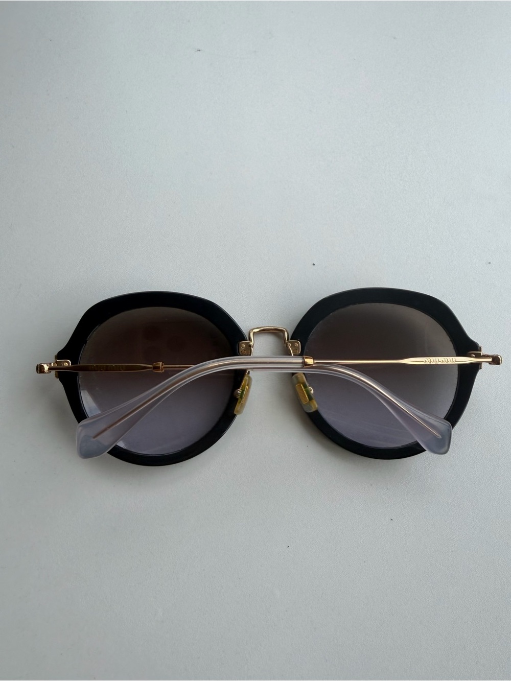 Miu Miu Women's Black Round Sunglasses with Gold Bridge - Picture 2 of 3